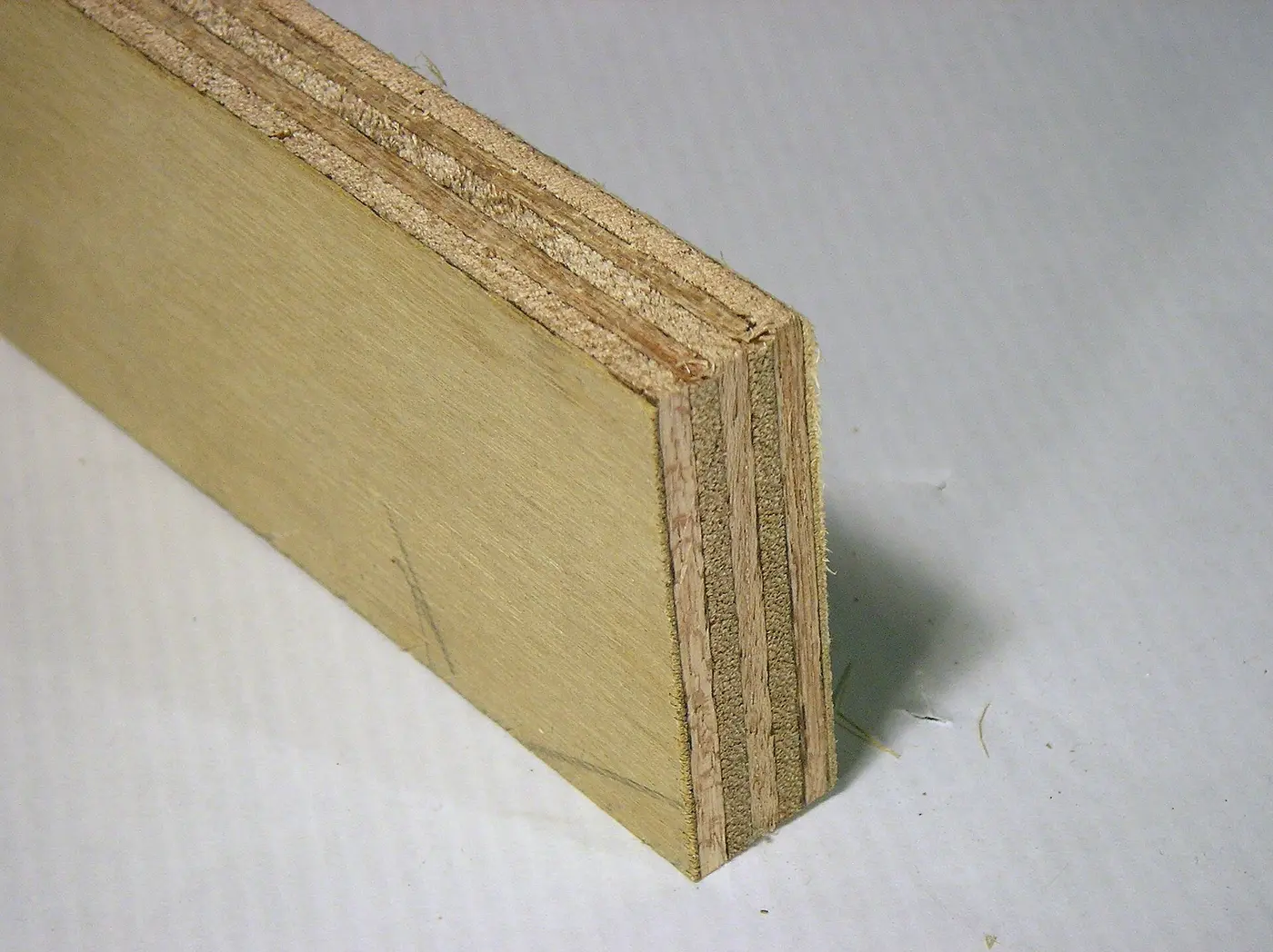 A sheet of plywood showing its surface and edge