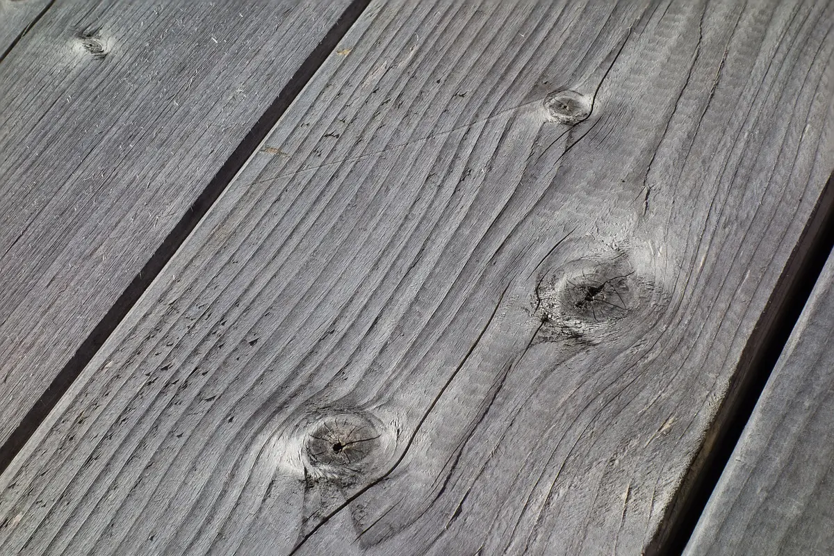 Solid wood planks showing natural grain and knots
